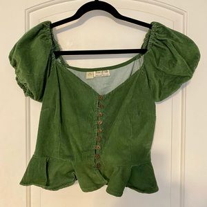 Green cropped peplum type shirt